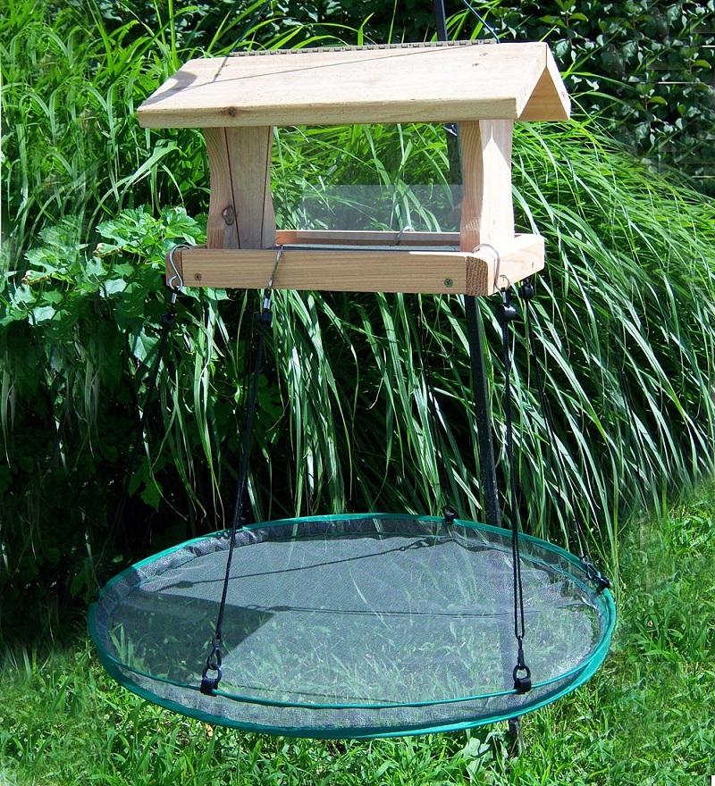 Wood bird feeder with seed catching platform feeder underneath